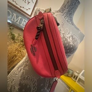 Coach fanny pack, crossbody, leather Pink. Like New, No damage, used twice.